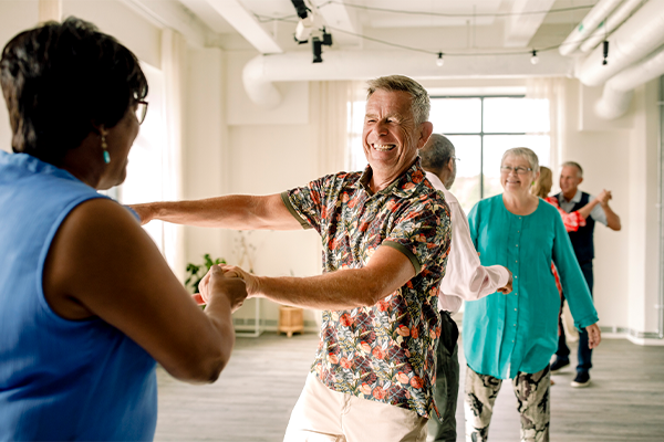 Older adults dancing and having fun together