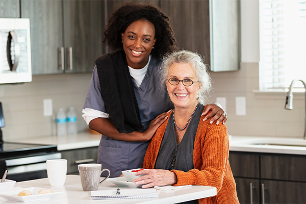 Young woman caregiver with senior woman client who is still very healthy